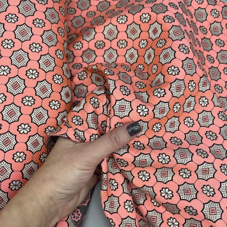 Жаккард неонового кораллового цвета с геометрически рисунком