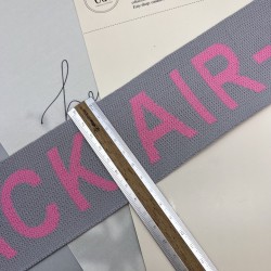 Тесьма трикотажная жаккардовая с текстом, светло-серая