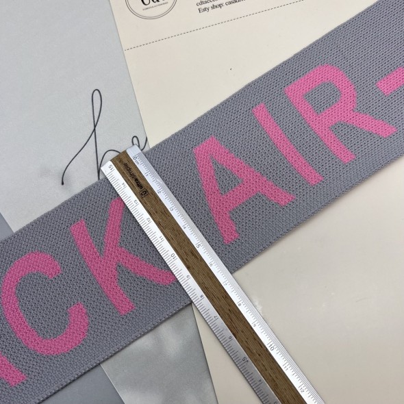 Тесьма трикотажная жаккардовая с текстом, светло-серая