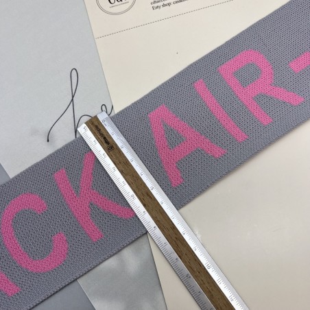 Тесьма трикотажная жаккардовая с текстом, светло-серая