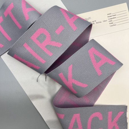 Тесьма трикотажная жаккардовая с текстом, светло-серая