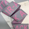 Тесьма трикотажная жаккардовая с текстом, светло-серая