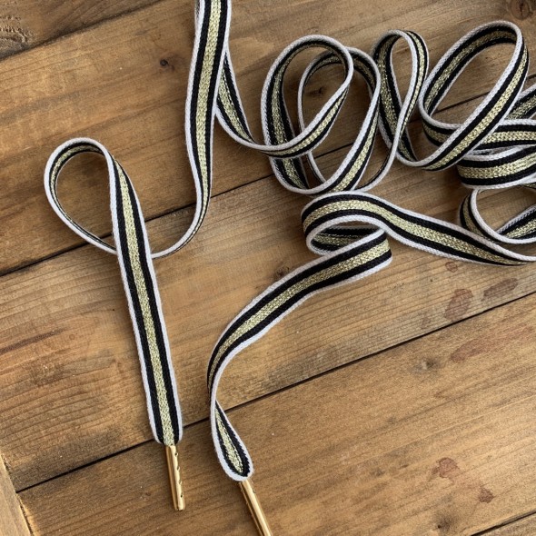 Шнурки черно-белые с золотистой полоской,мягкие,вискозные