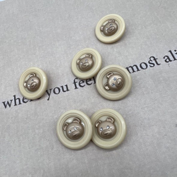 Пуговицы пластик на ножке молочные с золотистыми мишками, 25 мм