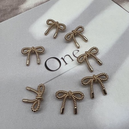 Пуговицы метал на ножке в виде бантиков золотистого цвета, 23 мм