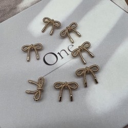 Пуговицы метал на ножке в виде бантиков золотистого цвета, 23 мм