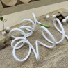 Шнурок трикотажный кругловязаный белый с прорезиненными наконечниками зеленого цвета