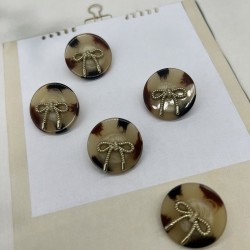 Пуговицы бежевые пластик на ножке с бантиками, 25 мм
