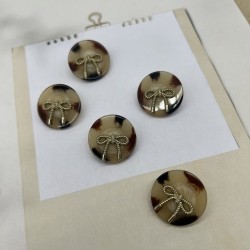 Пуговицы бежевые пластик на ножке с бантиками, 25 мм