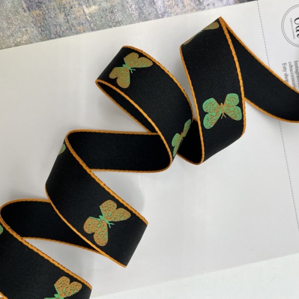 Тесьма репсовая плотная черная с бабочками, 2.5 см