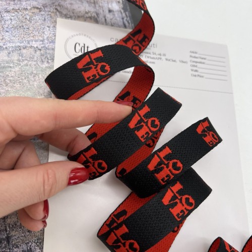 Тесьма жаккардовая чёрная с красными буквами, 2 см 2