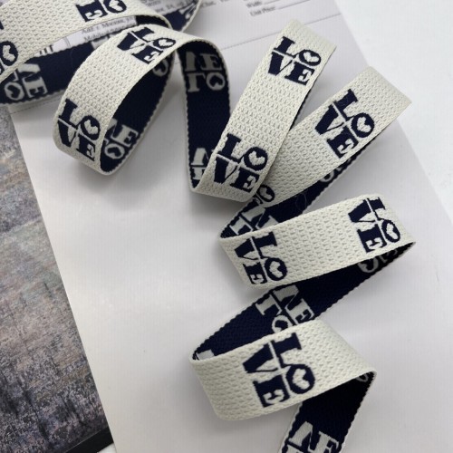 Тесьма жаккардовая молочная с чёрными буквами, 2 см 2